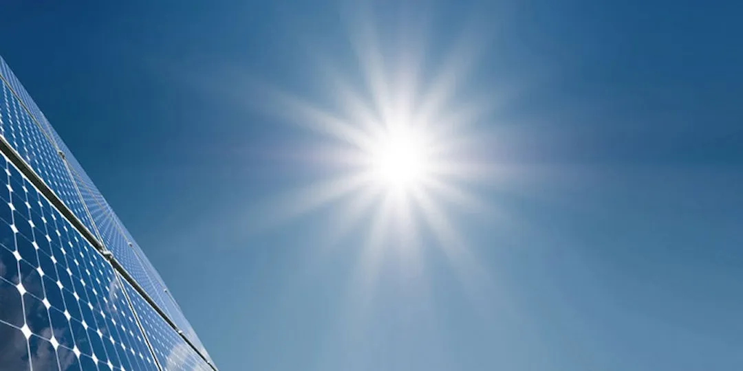 4 solar panels with bright sun in background