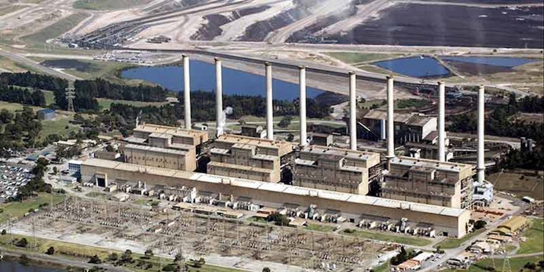 elevated view of coal fired power plant with coal mine in the distance