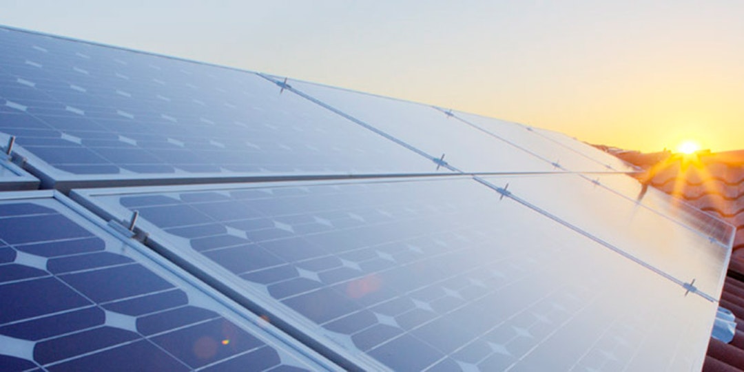 9 solar panels on tile roof at sunset