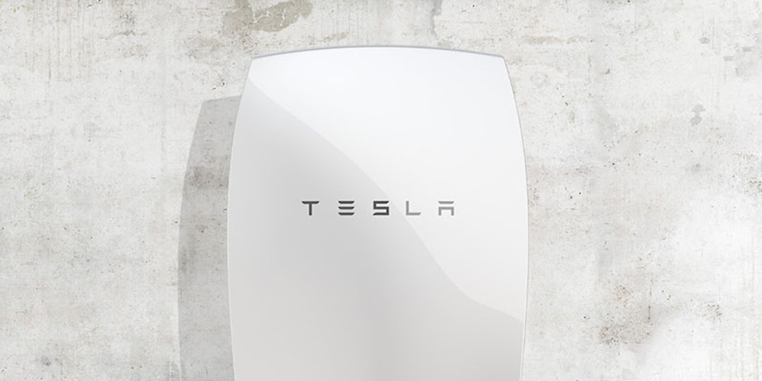 tesla powerwall battery mounted on concrete wall